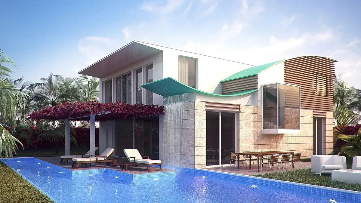 Terrasse d'un appart'hôtel en journée avec guide de Minorque et piscine en arrière‑plan